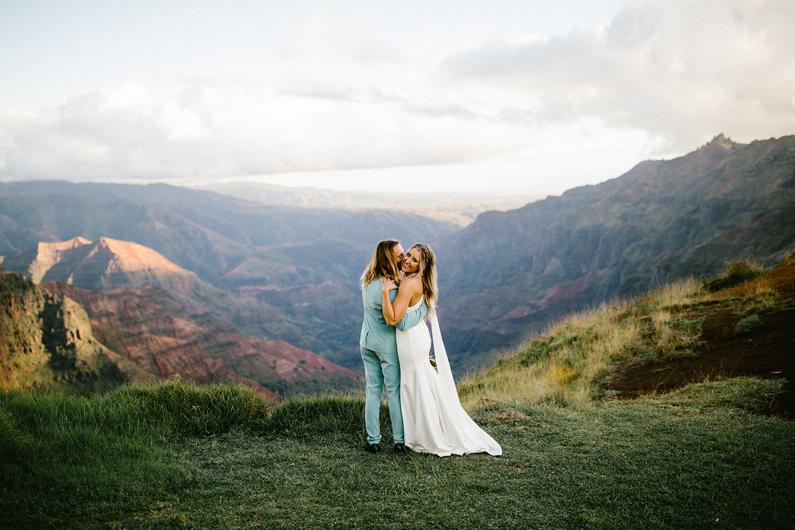 Waimea Canyon Elopement Kauai Hawaii by Mersadi Olson, Hawaii wedding, elopement and engagement photographer. This blog post includes wedding details, bridal fashion, groom fashion, bride and groom portraits, and elopement inspiration. Book your Hawaii elopement and browse the blog for inspiration #photography #weddingplanning #elopementtips #elopementphotography #elopement