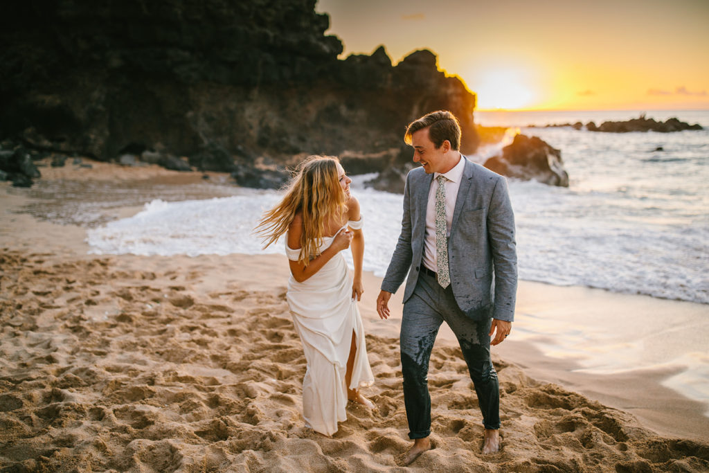 how to elope in Hawaii, couple on the beach during sunset at their elopement