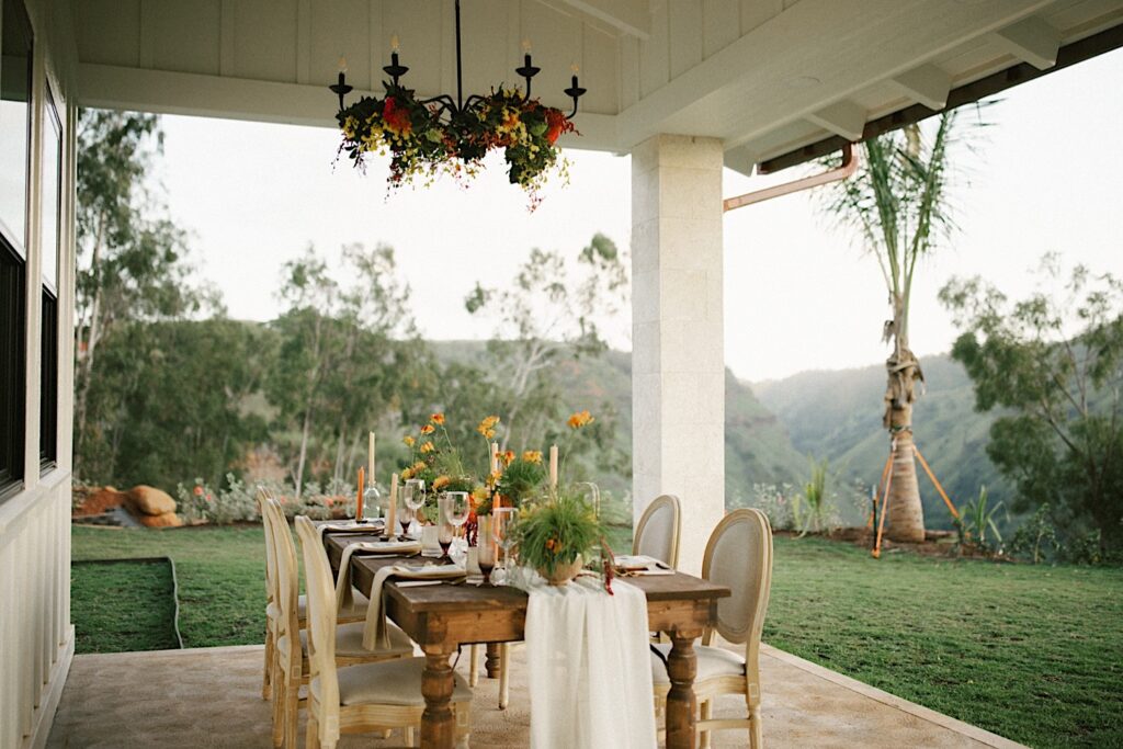 A table set up and decorated with florals for an intimate wedding reception at Waialua Valley Farms.