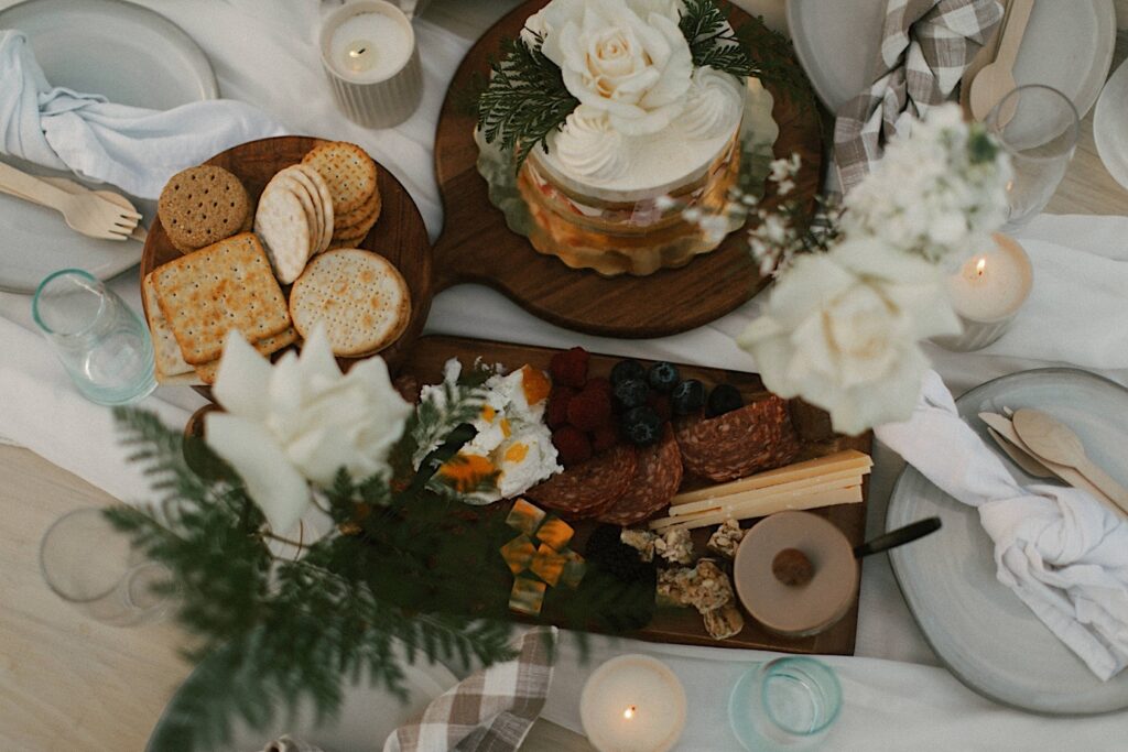 Detail photo of a picnic set up with snacks and a cake for an elopement celebration.