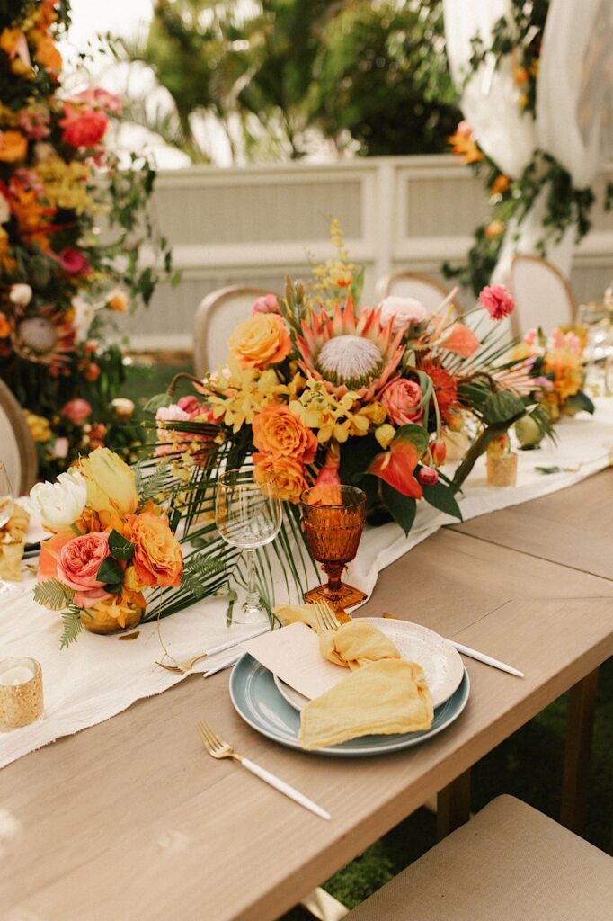 Closeup of a colorful tablescape at a wedding.