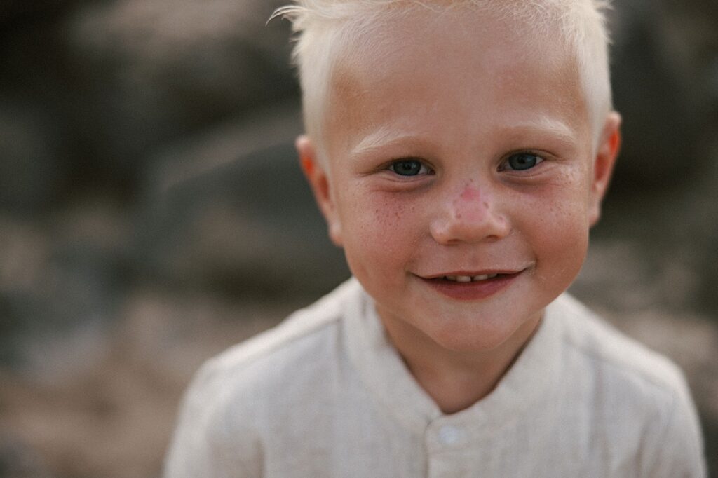 Portrait of young boy who's blond looking at the camera