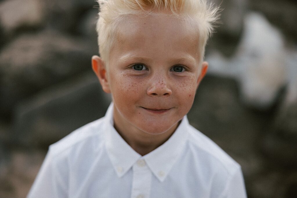Portrait of young boy who's blond looking at the camera