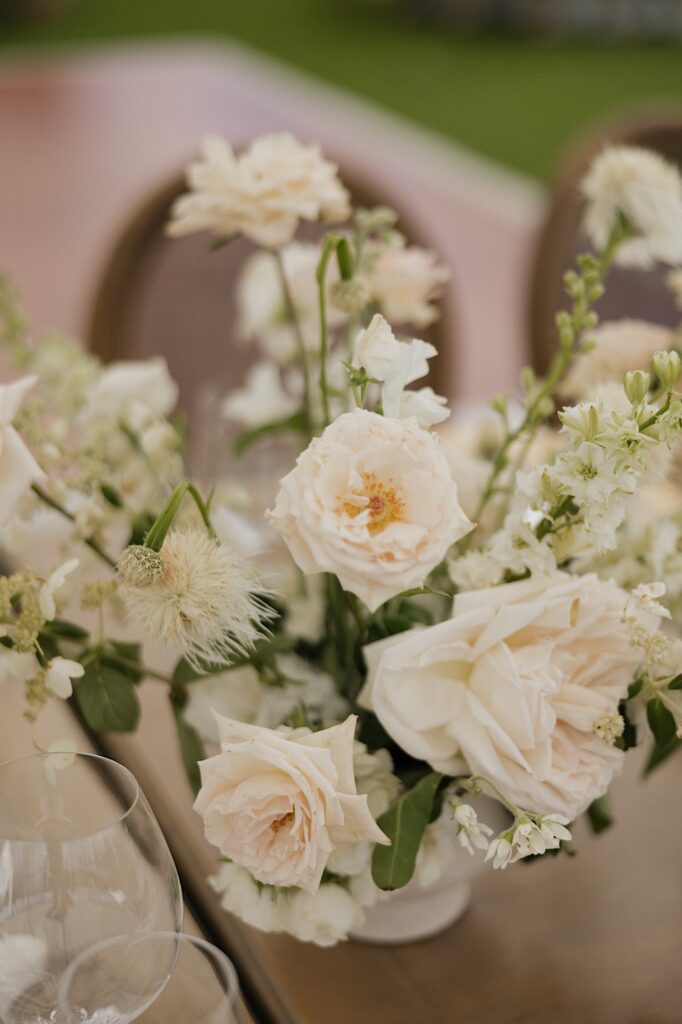 Detail photo of white flowers in a vase on a table